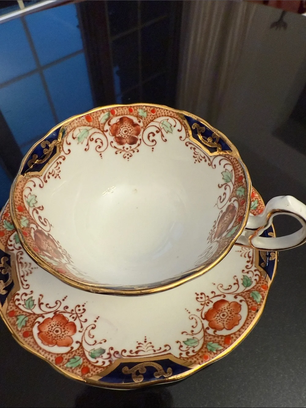 Decorative White and Navy Porcelain Tea Cup with Gold Accents